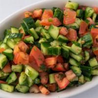 Shirazi Salad · Combination of fresh chopped cucumbers, tomatoes, onions and our house dressing.