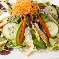 Salmon Skin Salad · Crispy salmon skin on a bed of organic spring mix, w/ avocado, tomato, cucumber, carrots and...