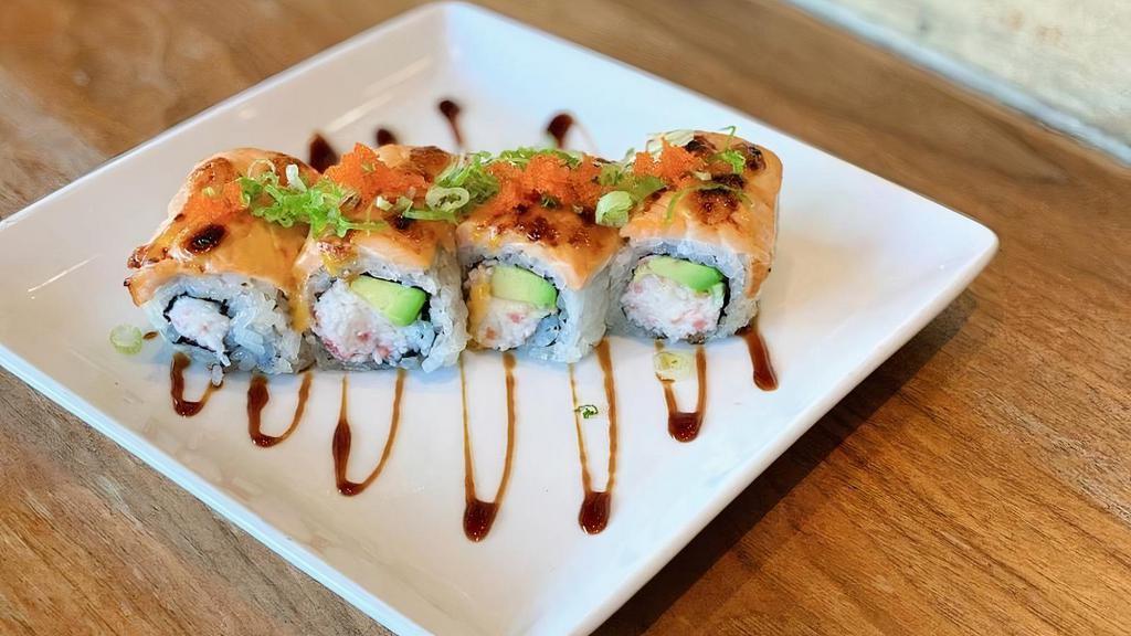 Alaska Roll · crab, avocado topped with baked salmon, . massago, scallions, spicy mayo & eel sauce
