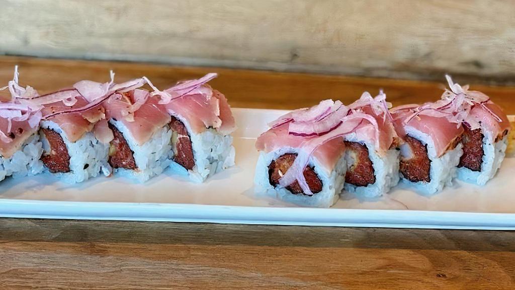 Phoenix Roll · Spicy shrimp, avocado, topped with seared . ahi tuna, red onion & ginger-apple sauce.