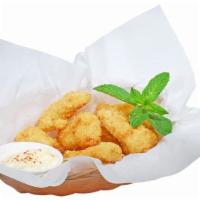 Golden Nuggets · Breaded Garden soy chickless nuggets served with house sauce.