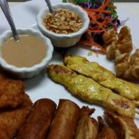 Leela Thai Sampler · A variety of our most popular appetizers: crispy roll (2), crab angel (3), satay chicken (2)...