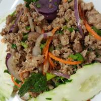 Larb Chicken Or Pork · Hot. Ground meat of your choice in chili, ground rice, green onion, cilantro and lemon juice...
