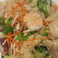 Leela Thai Fried Rice · Shrimp, chicken, cashew nut, peas, carrot, pineapple, onion, and egg.