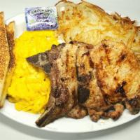 Pork Chops & Eggs · Two Pork Chops, three Eggs, Hash brown and two Slices of Toast + Jelly.