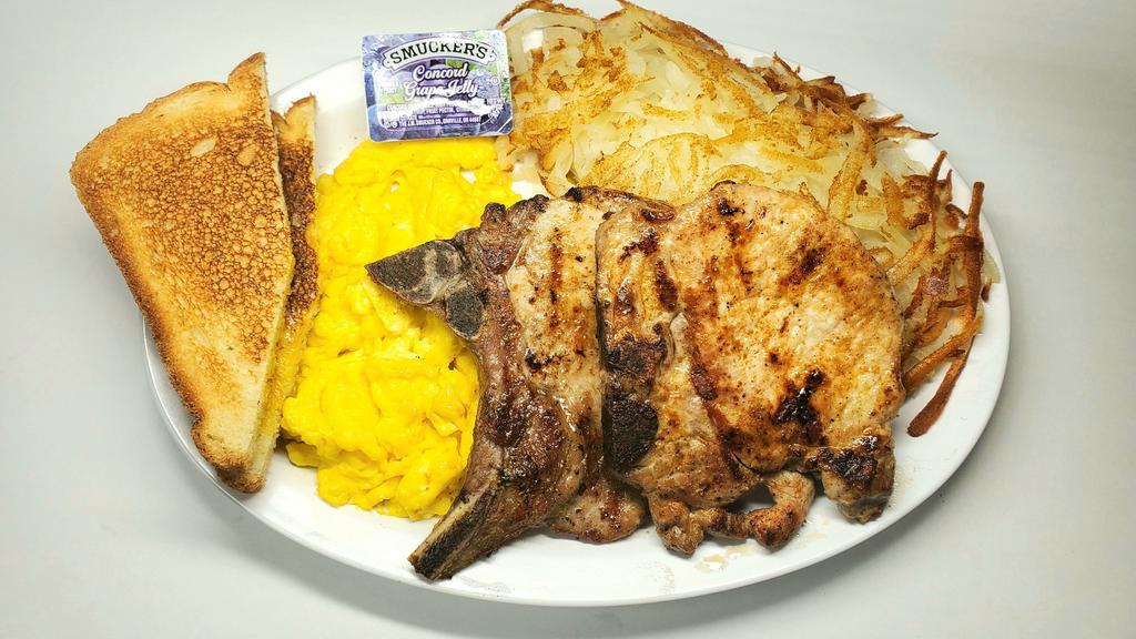 Pork Chops & Eggs · Two Pork Chops, three Eggs, Hash brown and two Slices of Toast + Jelly.