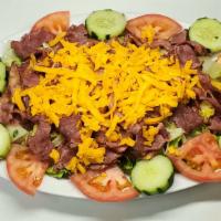 Pastrami Salad · Lettuce, cucumber, tomato, carrots, purple cabbage, pastrami, cheese, choice of dressing.