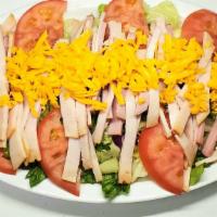 Chef Salad · Lettuce, cucumber, tomato, carrots, purple cabbage, chef patty, cheese, choice of dressing.