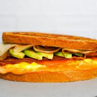 Sourdough, Smoked Turkey, Avocado, Egg, & Cheddar  · 2 scrambled eggs, melted Cheddar cheese, sliced smoked turkey, avocado, and Sriracha aioli o...