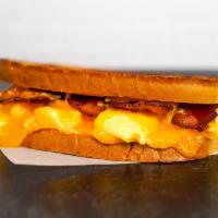 Sourdough, Bacon, Egg, & Cheddar   · 2 scrambled eggs, melted Cheddar cheese, smoked bacon, and Sriracha aioli on toasted sourdou...