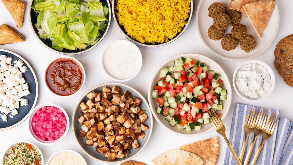 Family Meal · Family Meal Deal (Feeds 4) – The Family Meal feeds up to four people and includes Pitas, your choice of Protein, Falafel, Lettuce, Rice, Cucumber & Tomato Salad, Choice of 2 Toppings, 1 Side and 1 Sauce.