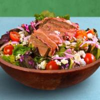Steak Salad · Choice of greens, sliced steak, tomatoes, onion, and goat cheese, tossed with your choice of...