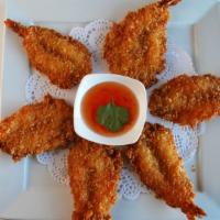 Butterfly Shrimp · Battered and breaded fried shrimp served with sweet and sour chili sauce.