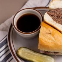 Brisket Dip Sandwich · On a French roll with au jus.