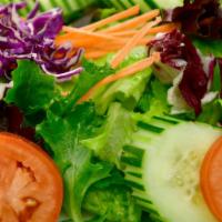 Green Salad · Iceberg lettuce & spring mix, tomatoes, cucumber, carrots, served with your choice of ginger...