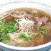 Pho With Beef Combination / Phở Đặc Biệt With Beef Broth · Rice noodles with combination, beef tendons, tripes, meatballs, rare steak and brisket.