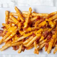 Bacon Cheese Fries · Crisp fries with chopped bacon and malted cheddar cheese (2 pcs).