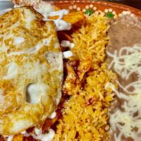 Red Chilaquiles  · Two fresh egg With chilaquiles with Chicken, rice and beans ,sour cream and cheese