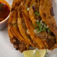 Quesabirria · 3 quesadillas with cheese, birria, onions and cilantro, includes  a consomé