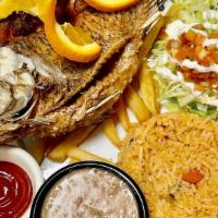 Mojarra Frita · Served with rice beans salad and flour or corn tortillas.