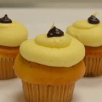 Monkey Mania · Banana cake filled with caramel, topped with cream cheese frosting.