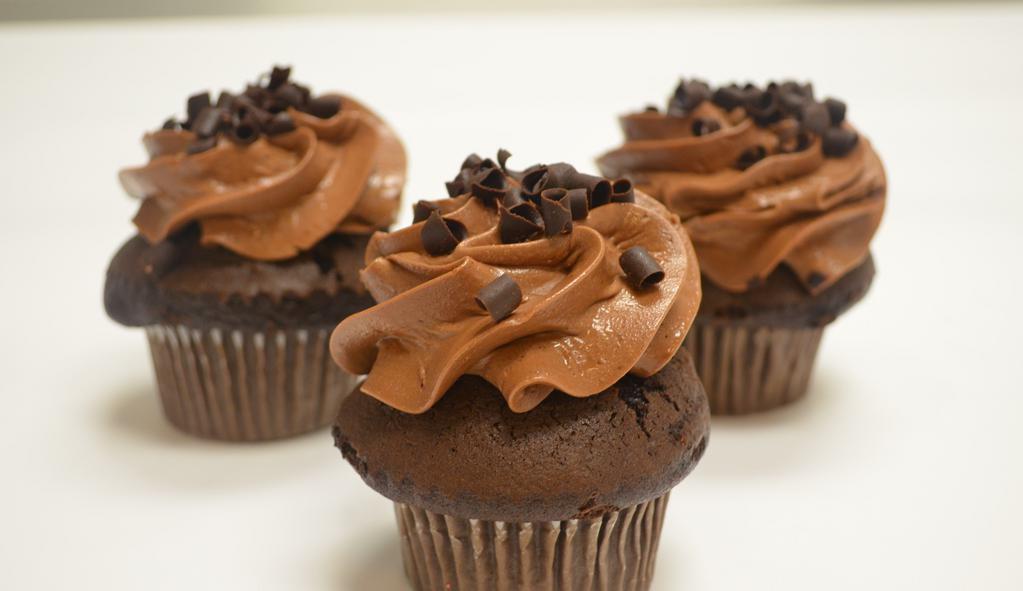 Chocolate Fix · Moist chocolate cake drenched in delicious chocolate buttercream frosting topped with chocolate shavings.
