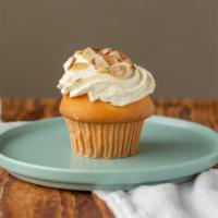 Italian Rum · Vanilla cake filled with Rum custard topped with whipped cream and toasted almonds