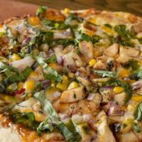 Sesame Chicken Flatbread · Grilled chicken, roasted corn, red onion, a blend of Italian cheeses, cilantro pesto and fre...
