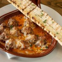 Gratin Chicken Meatballs · Japanese-style chicken meatballs, mixed cheese, smothered in spicy marinara sauce with toast...