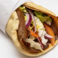 Gyro · Gyro Meat slices with Fresh lettuce, red tomatoes, red Onion and Tzatziki Sauce on Gyro Bread.