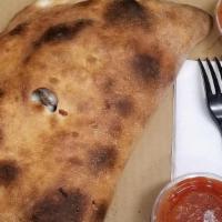 Supreme Calzone · Pepperoni, sausage, mushrooms, onions, bell peppers, black olives, ricotta and mozzarella.