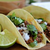 Tacos · Street stile taco with homemade tortilla your choice of meat topped with cilantro and onion.