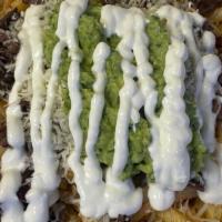 Asada Fries · French fries with carne asada topped with cheese, guacamole & sour cream