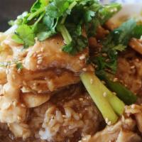 Sesame Chicken · Stir-fried chicken in house gravy sauce. Served with steamed rice and topped with sesame see...