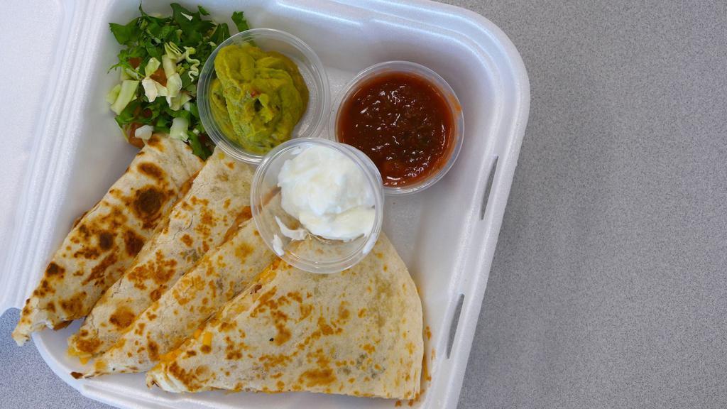 Chicken Quesadilla · Choose from half or full size. With melted cheddar cheese, all white meat chicken, lettuce, tomatoes, onions, jalapeno and served with a side of guacamole.