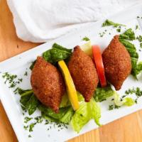 Kebbeh Balls · Ground beef and cracked wheat stuffed with minced meat, onions, and pine-nuts (3 pieces).