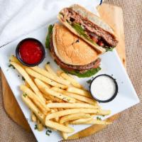 Classic Burger · 1/2 lb. of ground beef garnished with crisp lettuce and mayo. Served with fries.