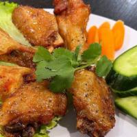 Chicken Wings / Cánh Gà Chiên · Choose one: Cajun, buffalo hot sauce, lemon pepper, sweet and sour, or house special.