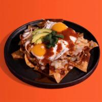 Chilaquiles · Crispy corn tortilla chips covered with your choice of salsa verde (green) or salsa roja (re...