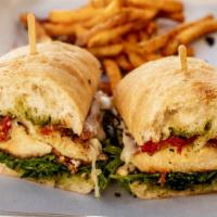 Chicken “Omg” · Prosciutto, mozzarella, pesto, roasted tomato arugula, ciabatta, fries.