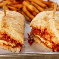 Chicken Parmesan · Panko chicken, marinara, mozzarella, Parmesan, ciabatta, fries.