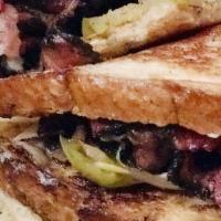 Monsieur Rueben · pastrami, green kraut, swiss cheese, monk mustard, grilled onions. Comes with side of Skinny...