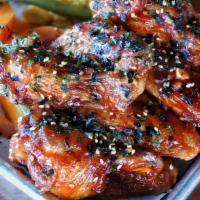 Spiced Honey Wings · bbq glaze, garlic, bleu cheese dressing, furikake, pickled vegetables
