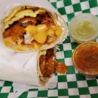 Chicken Breakfast Burrito · W/ Tater Tots , Chicken Tenders,  Eggs and Melted  Cheese.