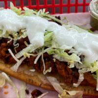 Huaraches  · One Maseca Tortilla W/ Beans,Meat,Cotija Cheese, Lettuce and Sour  Cream.