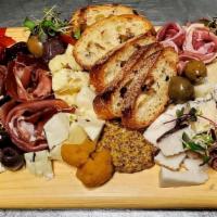 Charcuterie + Cheese Board · cured meats and artisan cheeses, fruits, nuts