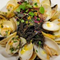 Vongole · squid ink linguini, clams, garlic, butter, white wine, saffron, lemon, herbs