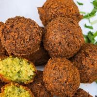 Falafel (6 Pieces) · Ground chickpeas, broad beans herbs, and mixed spices.