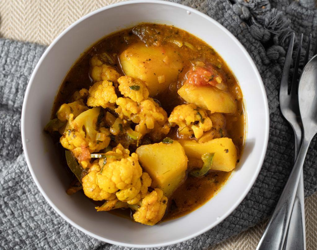 Aloo Gobi · Fresh cauliflower and potatoes cooked with herb and spices.