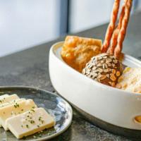 Bread & Butter
 · House-made rosemary focaccia, rye bread, and parmesan gougeres, served with butter.
